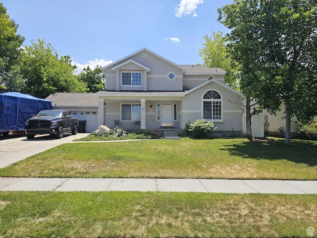 506 E 670 N, Tooele, UT 84074 - traditional-style house featuring an attached garage, covered porch, stucco siding, a front yard, and concrete driveway