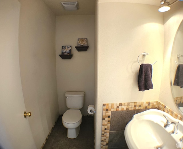 506 E 670 N, Tooele, UT 84074 - bathroom featuring toilet, a sink, and tile patterned flooring
