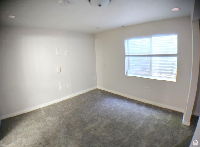 506 E 670 N, Tooele, UT 84074 - unfurnished room featuring dark colored carpet and baseboards