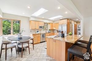 3525 E Ceres Dr S, Millcreek, UT 84124 - kitchen featuring light brown cabinets, stainless steel dishwasher, refrigerator, recessed lighting, and white microwave