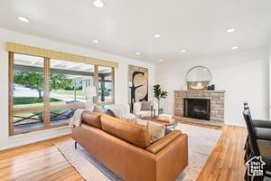 3525 E Ceres Dr S, Millcreek, UT 84124 - living room featuring plenty of natural light, light wood-style floors, a fireplace, and recessed lighting