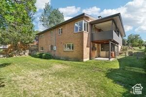 3525 E Ceres Dr S, Millcreek, UT 84124 - back of house featuring a lawn and a balcony