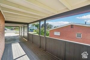 3525 E Ceres Dr S, Millcreek, UT 84124 - unfurnished sunroom featuring beamed ceiling and plenty of natural light
