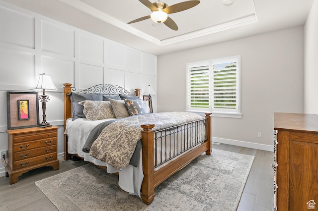 88 N Parkside Loop W, Elk Ridge, UT 84651 - bedroom featuring a tray ceiling, wood finished floors, and ceiling fan