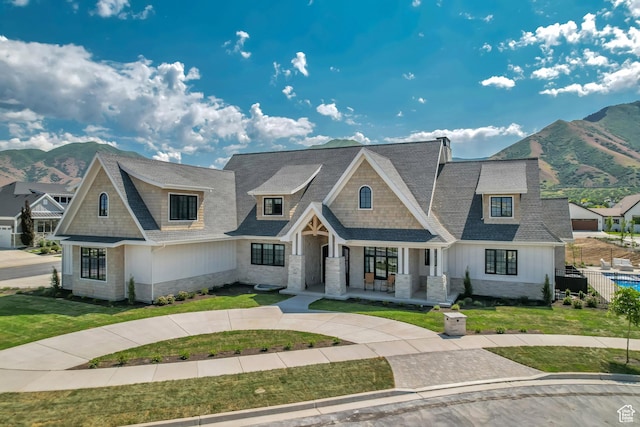 423 S 150 E, Mapleton, UT 84664 - view of front of house featuring stone siding, a mountain view, covered porch, and a shingled roof