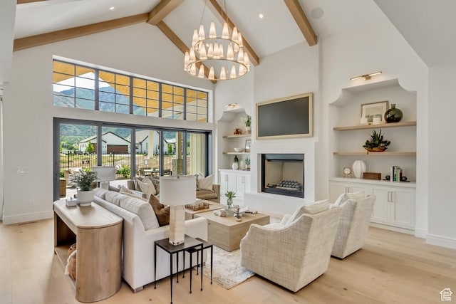 423 S 150 E, Mapleton, UT 84664 - living area featuring beamed ceiling, high vaulted ceiling, light wood-type flooring, a fireplace, and built in features