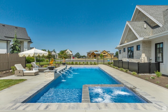 423 S 150 E, Mapleton, UT 84664 - view of swimming pool featuring a patio area, a fenced backyard, a pool with connected hot tub, and a residential view