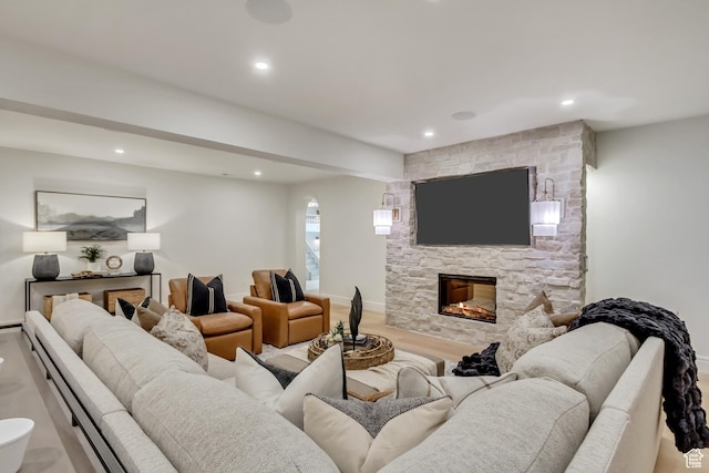 423 S 150 E, Mapleton, UT 84664 - living room with recessed lighting, a fireplace, arched walkways, wood finished floors, and beamed ceiling