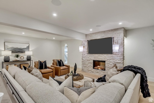423 S 150 E, Mapleton, UT 84664 - living room with a stone fireplace, recessed lighting, light wood-style floors, and beamed ceiling