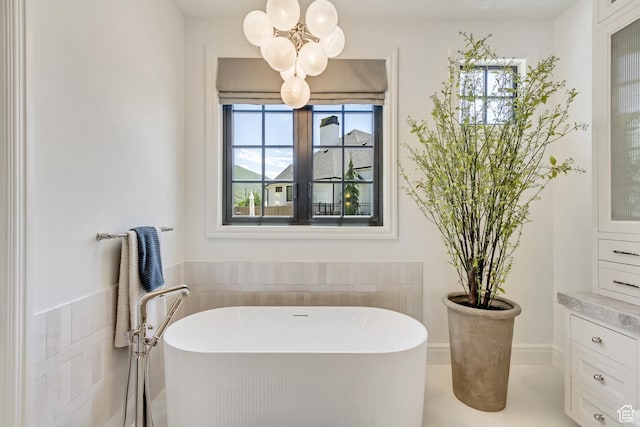 423 S 150 E, Mapleton, UT 84664 - bathroom featuring a freestanding bath, plenty of natural light, and a chandelier