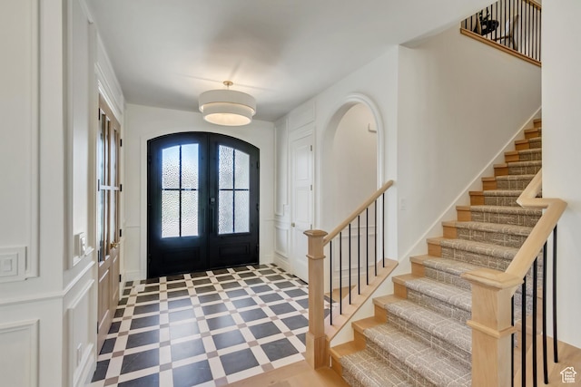 423 S 150 E, Mapleton, UT 84664 - foyer with a decorative wall, stairway, french doors, and arched walkways