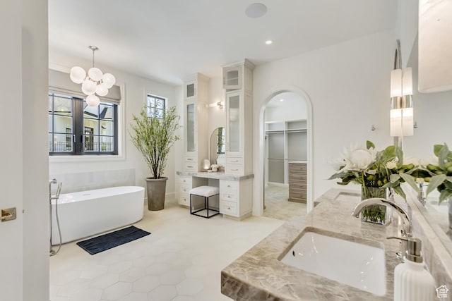 423 S 150 E, Mapleton, UT 84664 - bathroom with double vanity, a freestanding bath, recessed lighting, a chandelier, and a walk in closet