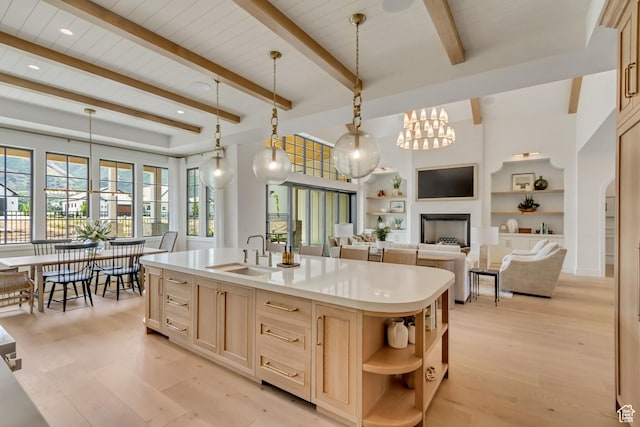 423 S 150 E, Mapleton, UT 84664 - kitchen with light brown cabinetry, open shelves, light countertops, light wood-style floors, and pendant lighting
