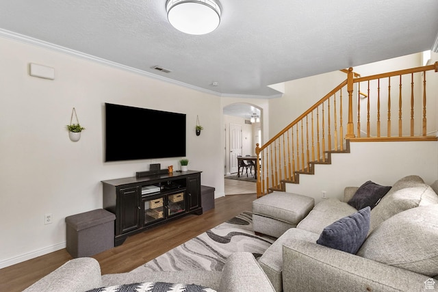 3709 S Angelico Ct Unit D, West Valley City, UT 84119 - living area with arched walkways, stairs, wood finished floors, ornamental molding, and baseboards