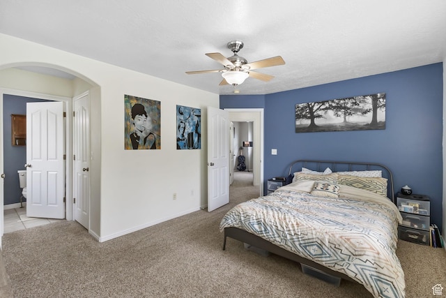 3709 S Angelico Ct Unit D, West Valley City, UT 84119 - bedroom with carpet, arched walkways, baseboards, and a ceiling fan