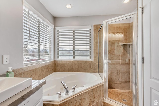 5617 W High Spirit Ct, Herriman, UT 84096 - bathroom with a tub with jets, a stall shower, vanity, and recessed lighting