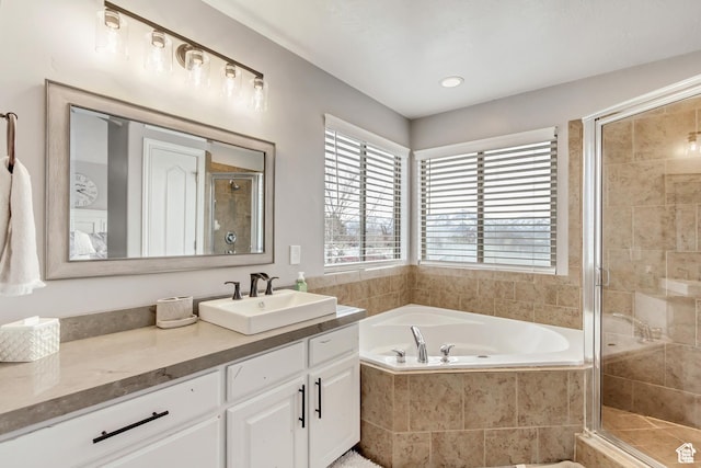 5617 W High Spirit Ct, Herriman, UT 84096 - full bathroom featuring vanity, a garden tub, and a shower stall