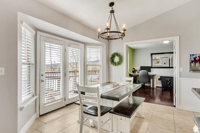 5617 W High Spirit Ct, Herriman, UT 84096 - dining room with a chandelier, light tile patterned flooring, a desk, and wainscoting