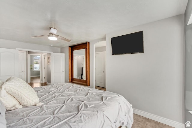 5617 W High Spirit Ct, Herriman, UT 84096 - bedroom featuring arched walkways and a ceiling fan