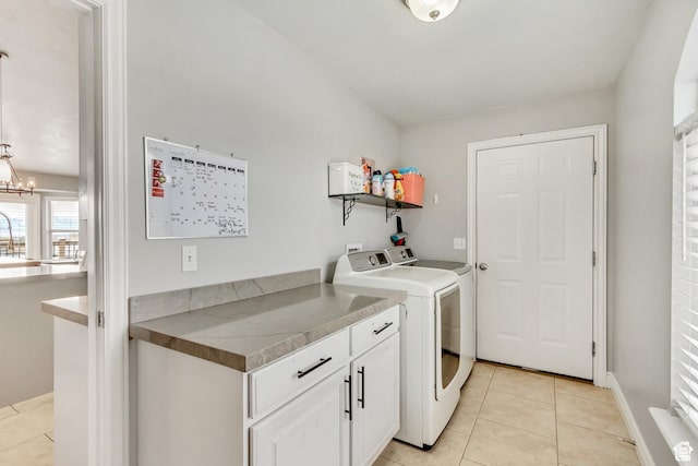 5617 W High Spirit Ct, Herriman, UT 84096 - laundry room featuring light tile patterned flooring, a chandelier, and separate washer and dryer