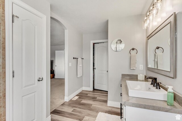 5617 W High Spirit Ct, Herriman, UT 84096 - bathroom with vanity and wood finished floors