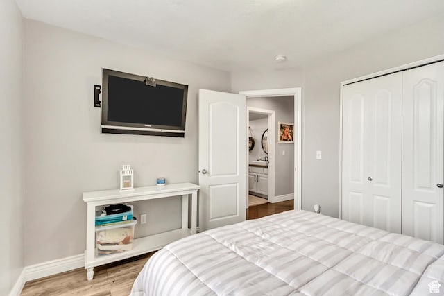 5617 W High Spirit Ct, Herriman, UT 84096 - bedroom featuring wood finished floors and a closet