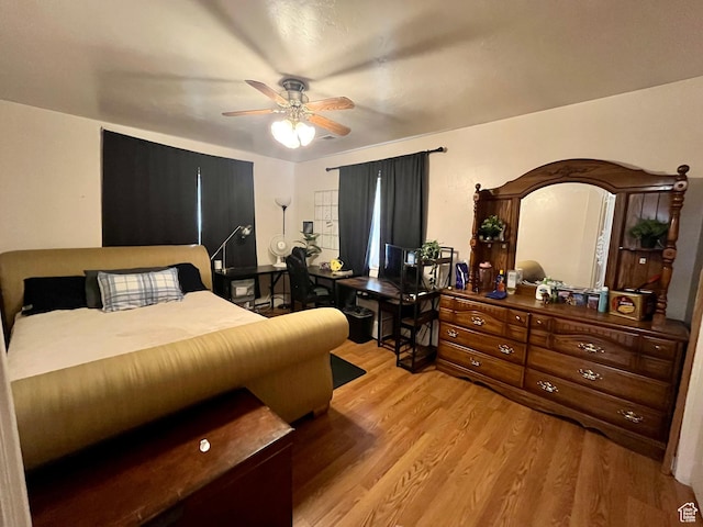 766 Huntridge Dr, Moab, UT 84532 - bedroom with light wood-style floors and ceiling fan