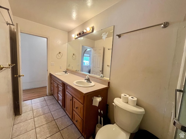 766 Huntridge Dr, Moab, UT 84532 - bathroom with double vanity, toilet, and tile patterned flooring