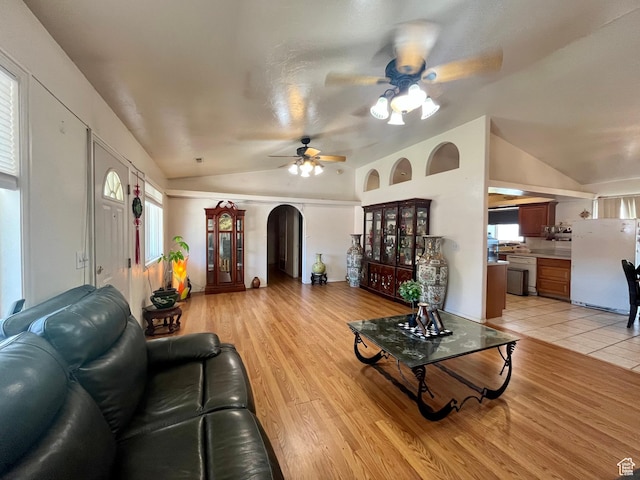 766 Huntridge Dr, Moab, UT 84532 - living room with vaulted ceiling, arched walkways, ceiling fan, and light wood finished floors