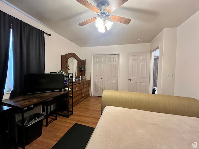 766 Huntridge Dr, Moab, UT 84532 - bedroom with light wood-type flooring, a closet, and ceiling fan