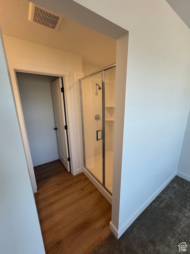 1650 N Main St N Unit 126, Layton, UT 84041 - full bathroom with a stall shower, baseboards, and wood finished floors