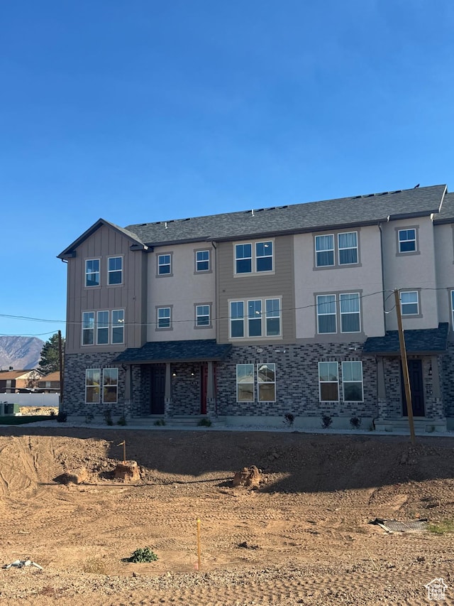 1650 N Main St N Unit 126, Layton, UT 84041 - view of front of home featuring board and batten siding and stone siding