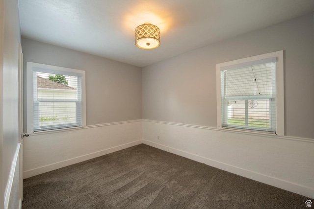 1779 E Ramona Ave S, Salt Lake City, UT 84108 - empty room with dark carpet and baseboards