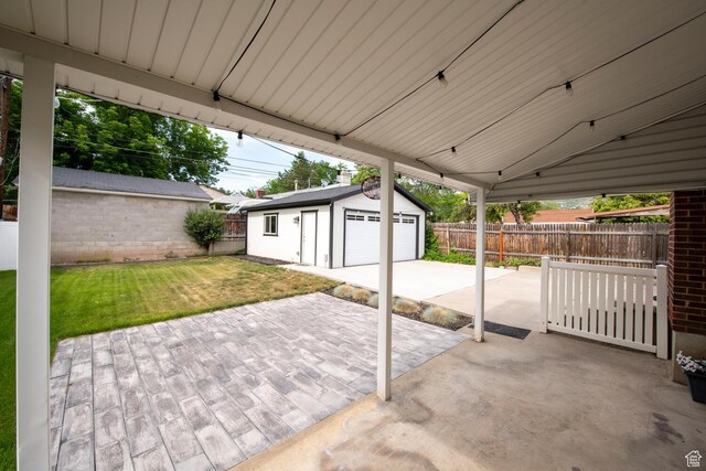 1779 E Ramona Ave S, Salt Lake City, UT 84108 - view of patio with a detached garage and an outbuilding