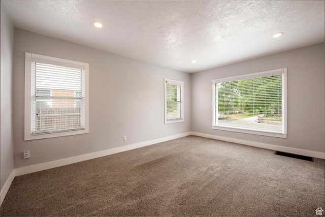1779 E Ramona Ave S, Salt Lake City, UT 84108 - carpeted spare room with baseboards, a textured ceiling, and recessed lighting