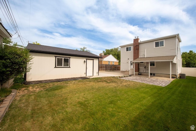 1779 E Ramona Ave S, Salt Lake City, UT 84108 - rear view of house featuring a patio area, central AC unit, a chimney, and an outdoor structure