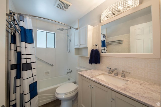 1779 E Ramona Ave S, Salt Lake City, UT 84108 - bathroom featuring vanity, shower / bath combination with curtain, toilet, and tasteful backsplash