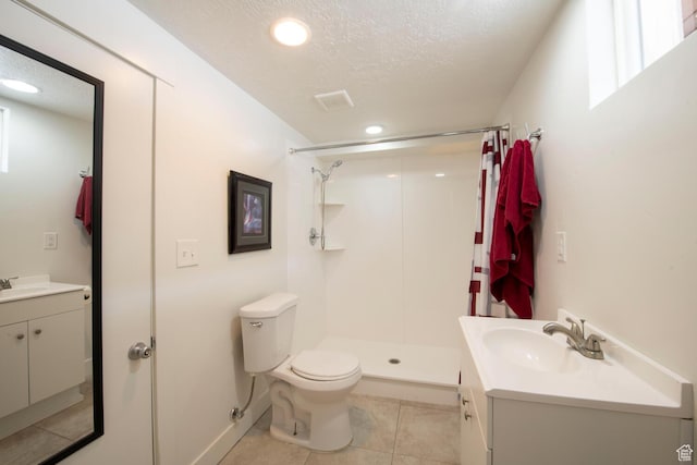 1779 E Ramona Ave S, Salt Lake City, UT 84108 - full bathroom with vanity, toilet, a shower stall, tile patterned flooring, and a textured ceiling