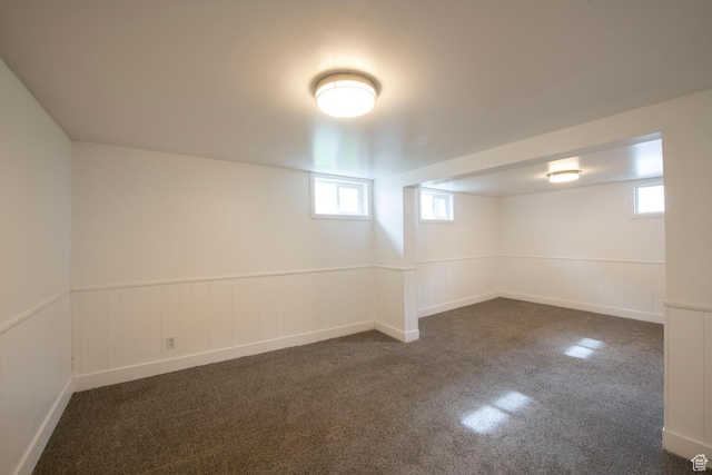 1779 E Ramona Ave S, Salt Lake City, UT 84108 - below grade area featuring dark colored carpet, healthy amount of natural light, and wainscoting