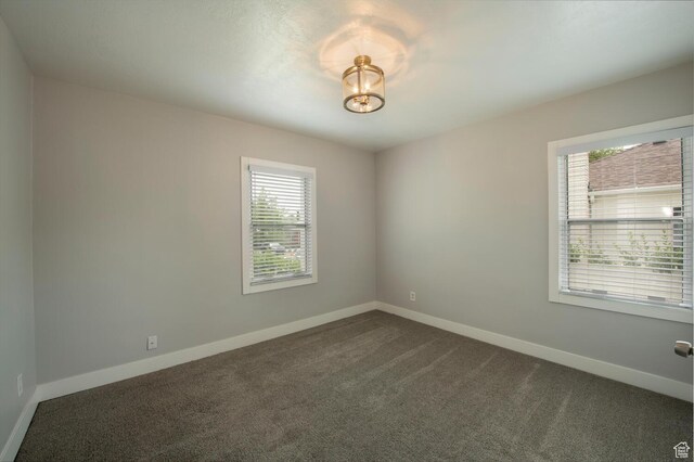 1779 E Ramona Ave S, Salt Lake City, UT 84108 - unfurnished room with dark carpet and baseboards