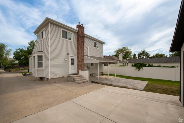1779 E Ramona Ave S, Salt Lake City, UT 84108 - back of property with a chimney and a patio area