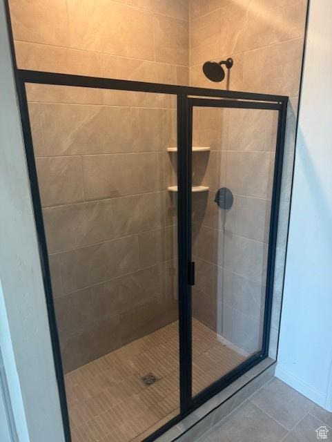 4063 W 2025 S Unit 39, Taylor, UT 84401 - bathroom with a stall shower and tile patterned flooring