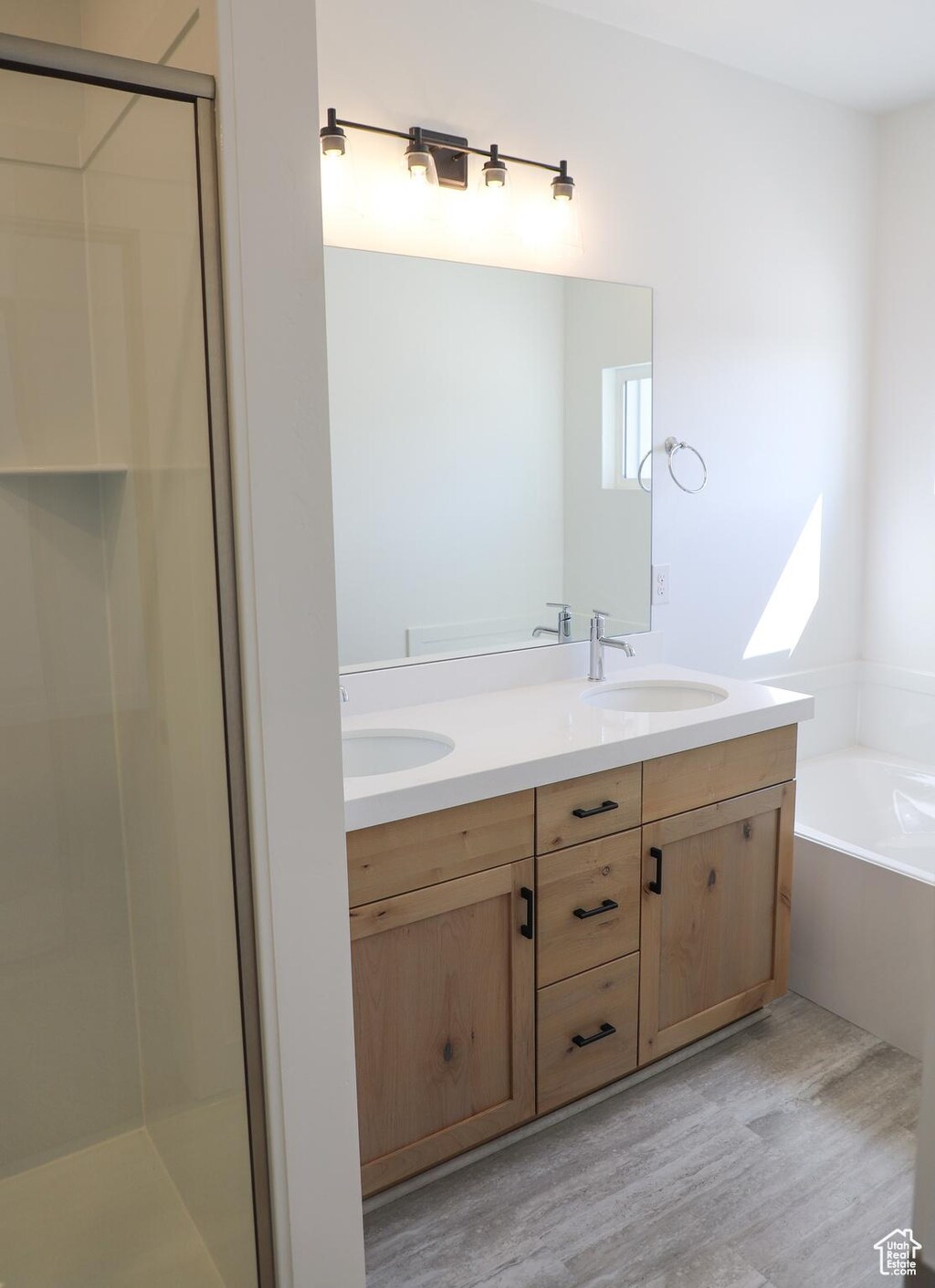 1907 E 1420 N, Spanish Fork, UT 84660 - full bath with wood finished floors, double vanity, a bath, and a stall shower
