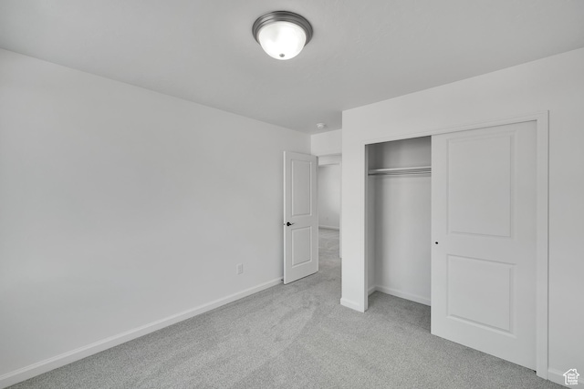 1972 E Burger St Unit 1236, Lake Point, UT 84074 - unfurnished bedroom with light carpet, baseboards, and a closet