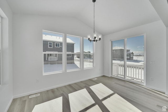 1972 E Burger St Unit 1236, Lake Point, UT 84074 - unfurnished dining area featuring a chandelier, plenty of natural light, lofted ceiling, wood finished floors, and baseboards