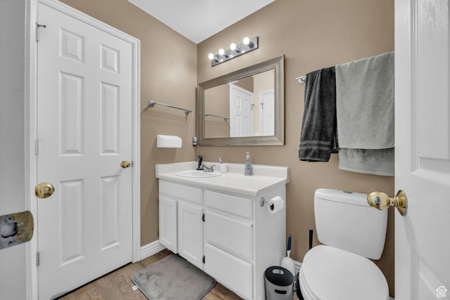 556 E 800 N, Ogden, UT 84404 - half bath featuring vanity, wood finished floors, toilet, and baseboards