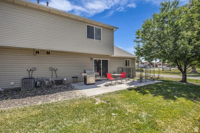 556 E 800 N, Ogden, UT 84404 - back of house with a yard, a patio, and central AC