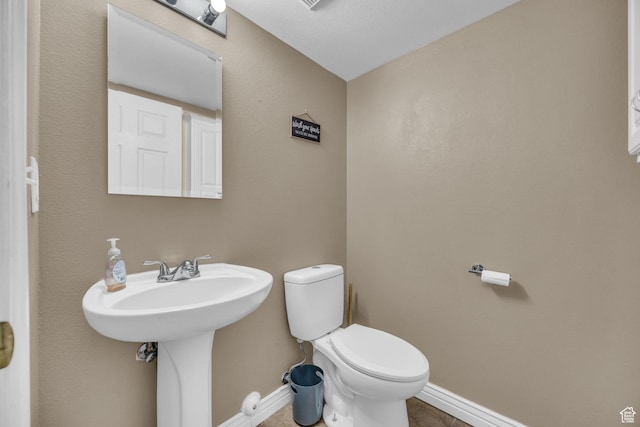 556 E 800 N, Ogden, UT 84404 - half bathroom with baseboards, toilet, and tile patterned flooring
