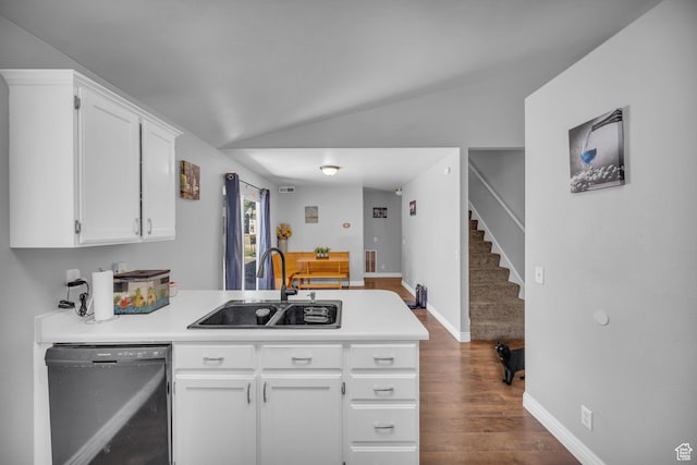 556 E 800 N, Ogden, UT 84404 - kitchen featuring dishwasher, a sink, a peninsula, white cabinetry, and vaulted ceiling