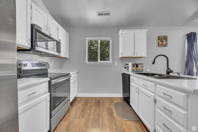 556 E 800 N, Ogden, UT 84404 - kitchen featuring stainless steel appliances, a sink, light countertops, and white cabinets